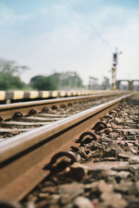 Surface level of railroad tracks against sky