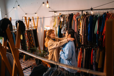 Rear view of woman standing in store