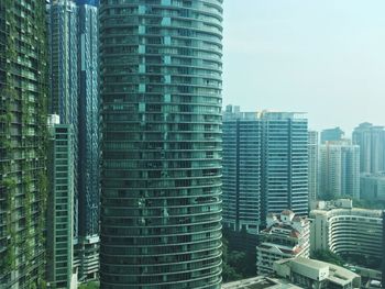 Modern buildings in city against sky