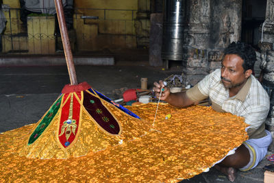 Man working with food in kitchen