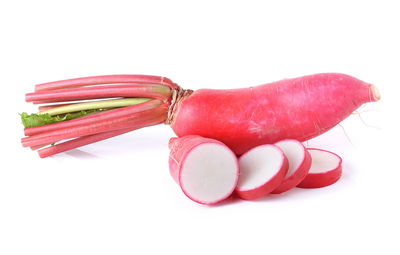 Close-up of red chili peppers against white background