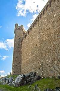 Low angle view of old building against sky