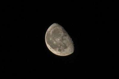 Low angle view of moon against clear sky at night