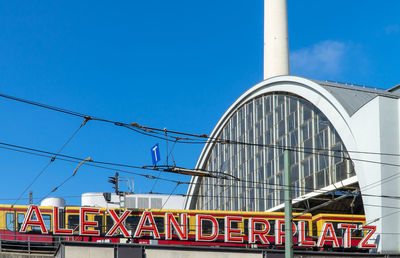 Low angle view of building against clear blue sky