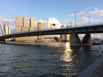 Bridge over river with buildings in background