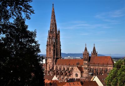 Low angle view of buildings in city against sky