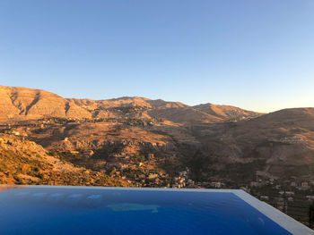 Scenic view of mountains against clear blue sky