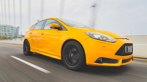 Yellow car on road