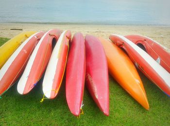 High angle view of colorful canoes at beach