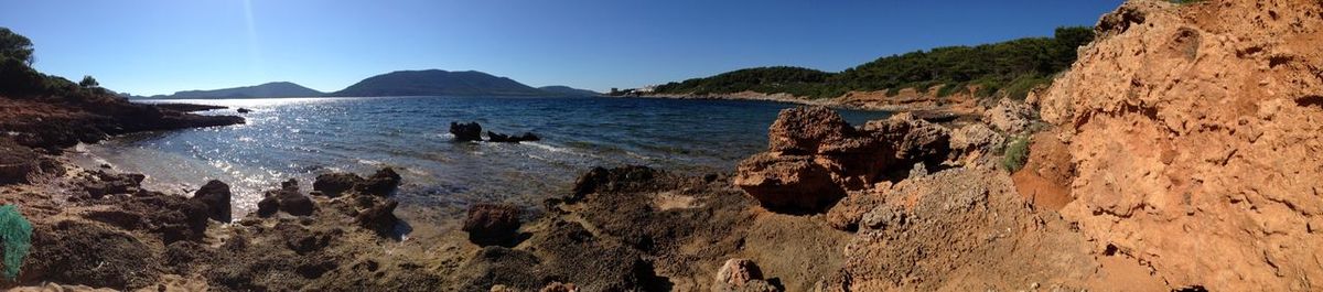 Scenic view of sea against clear blue sky
