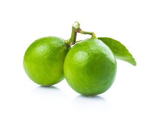 Close-up of fruit against white background