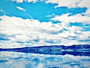 Scenic view of cloudscape over sea against sky