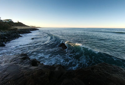 Scenic view of sea against clear sky