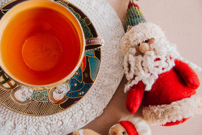 High angle view hot tea and santa claus christmas concept