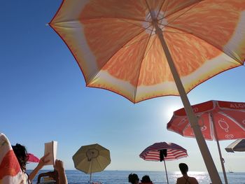 Umbrellas against clear sky