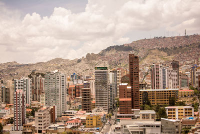 Buildings in city against sky