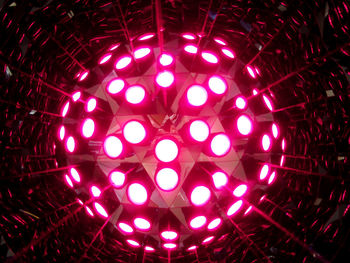 Low angle view of illuminated lights hanging from ceiling