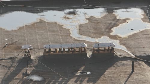 Shadow of boat on shore