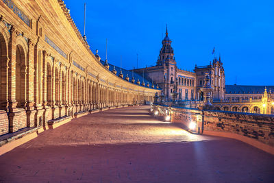 View of illuminated building against blue sky