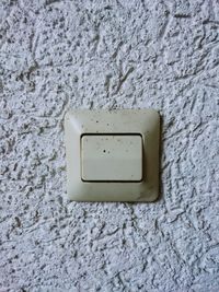 Close-up of electric lamp on wall