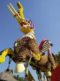 Low angle view of statue against sky