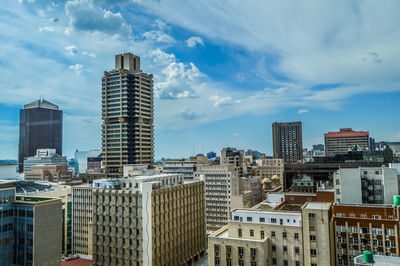 Modern buildings in city against sky