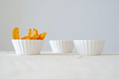 Close-up of food on table against white background