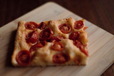 Close-up of pizza on cutting board