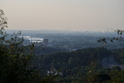 High angle view of buildings in city against sky