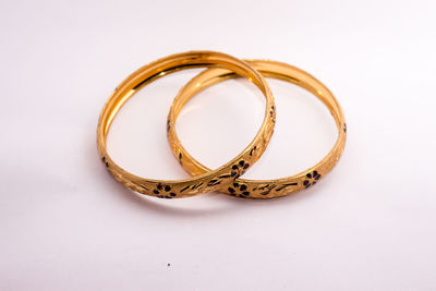 High angle view of wedding rings on white background