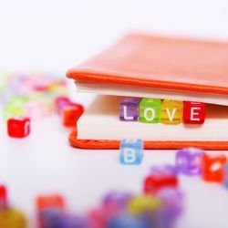 Close-up of toy blocks and book on table