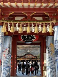 Group of people in temple outside building