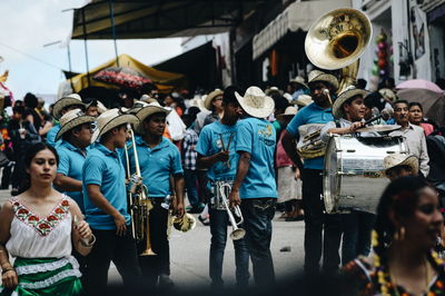 Group of people on street in city