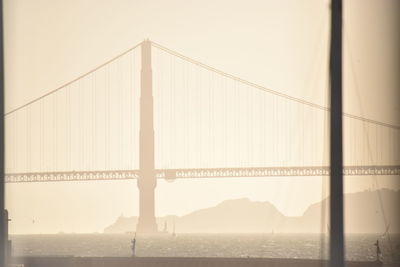 Suspension bridge over river in city