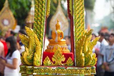 Golden buddha statue in city