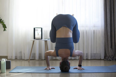 Rear view of woman with arms outstretched