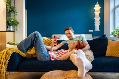 Young woman sleeping on sofa at home