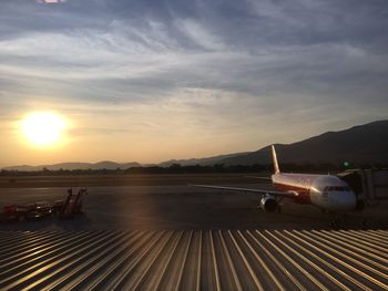 Scenic view of mountains against sky at sunset