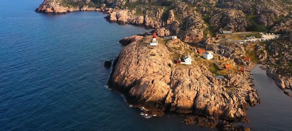 High angle view of rock formations by sea