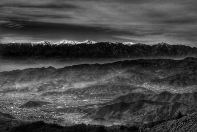 Scenic view of mountains against dramatic sky