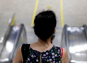 Rear view of woman in bus