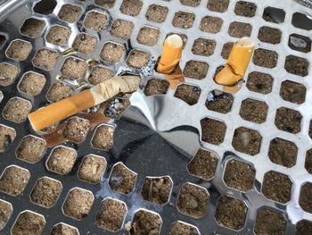 High angle view of cigarette on metal