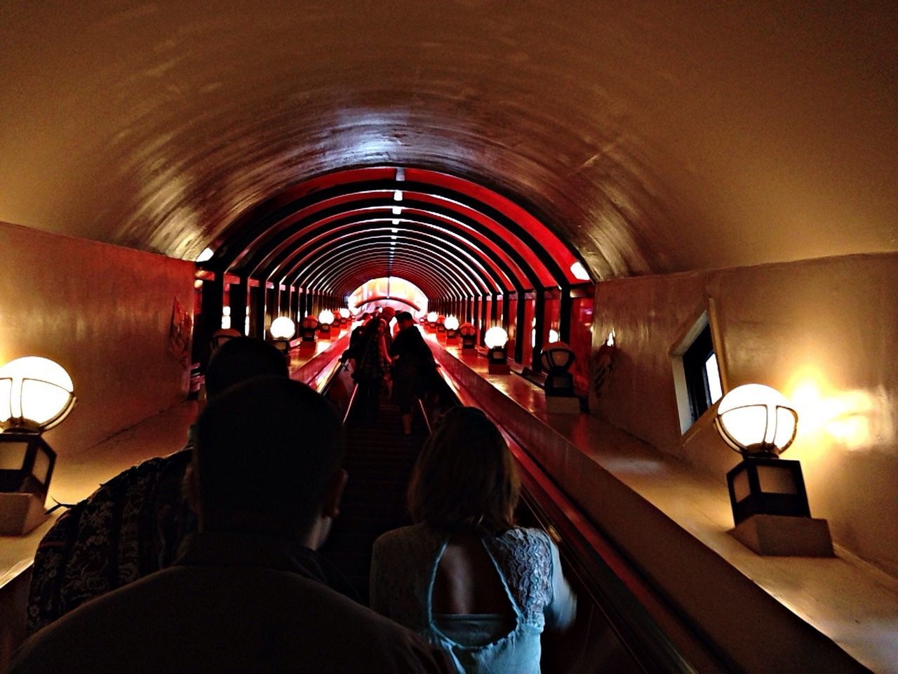 indoors, illuminated, ceiling, lighting equipment, arch, interior, subway, men, corridor, person, in a row, tunnel, underground, the way forward, empty, lifestyles, subway station, flooring, absence