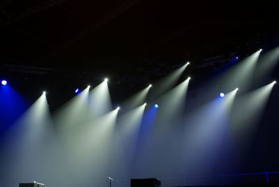 Low angle view of illuminated stage light