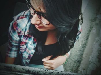 Close-up of young woman using mobile phone