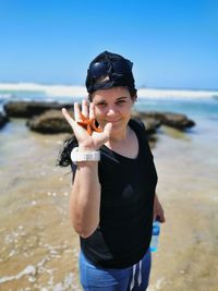 Full length of woman standing on beach