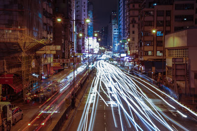 Illuminated city street at night