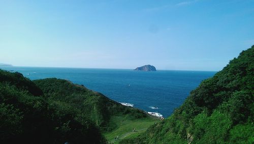 Scenic view of sea against clear blue sky