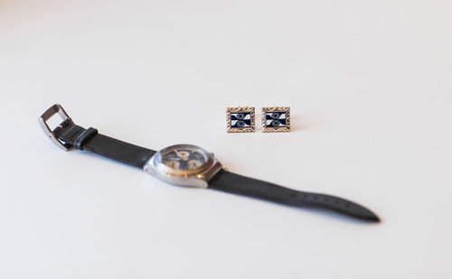 High angle view of tools on table against white background