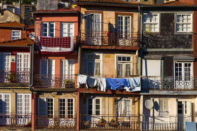 Laundry drying on balcony during sunset